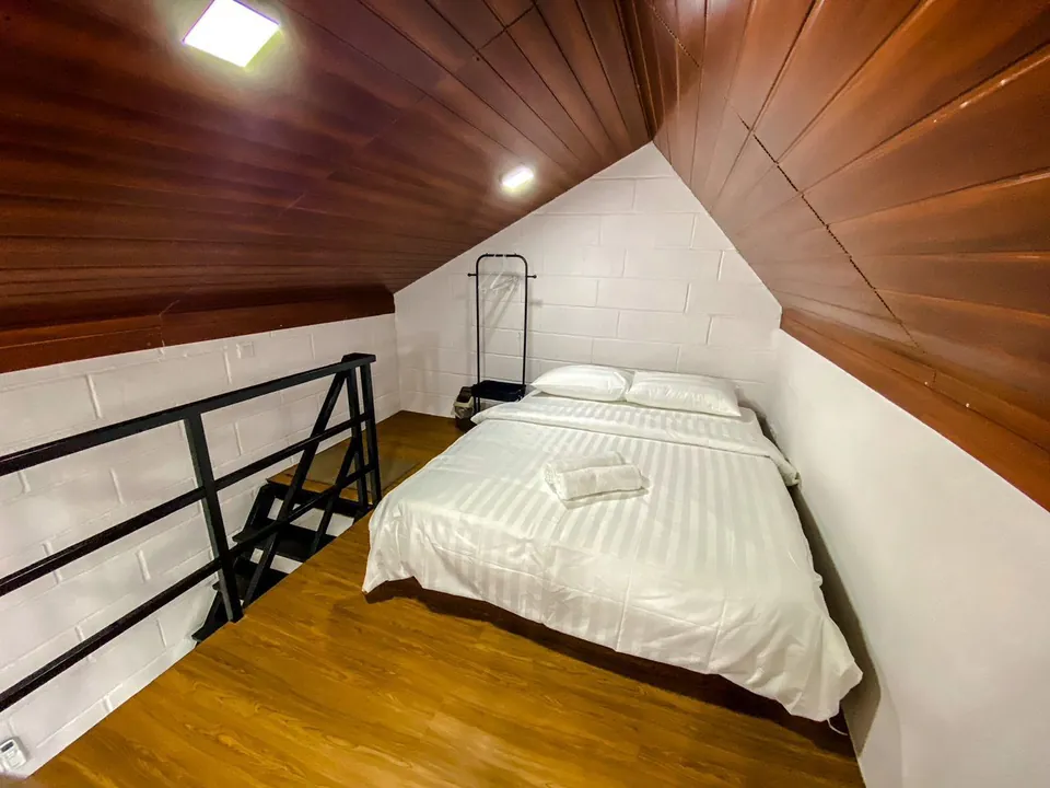 Loft bedroom with a wood grain PVC ceiling