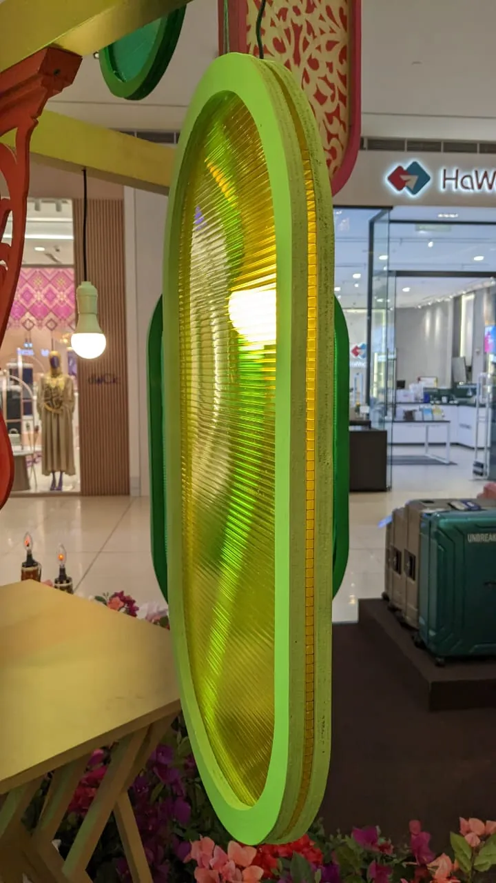 Green hollow polycarbonate display in a mall