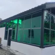 Building extension with green tinted polycarbonate walls